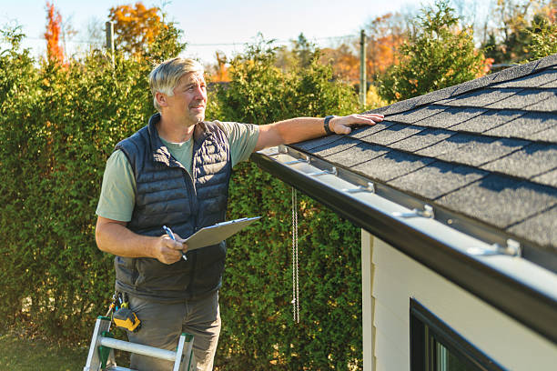 Professional Roofing technician working in London, CA